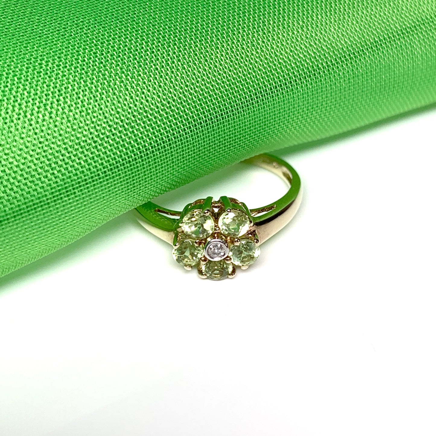 Peridot and diamond yellow gold daisy cluster ring