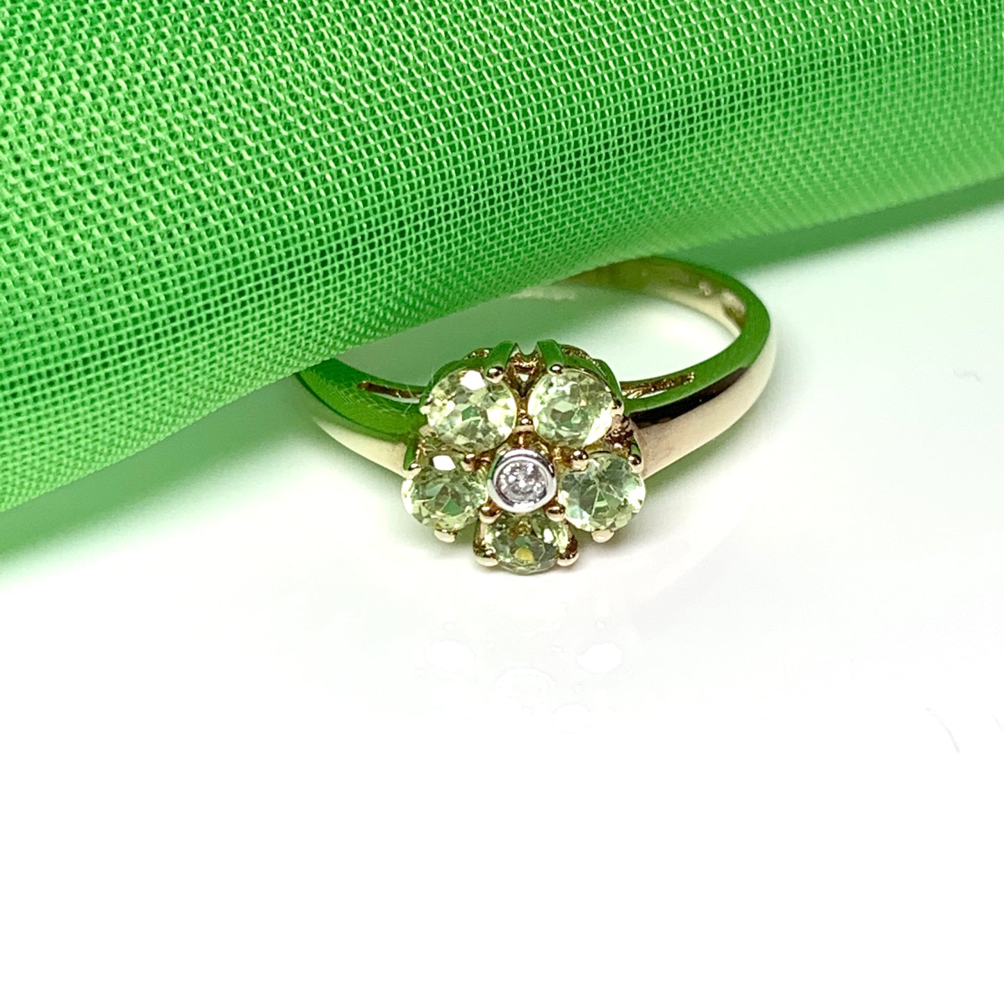 Peridot and diamond yellow gold daisy cluster ring