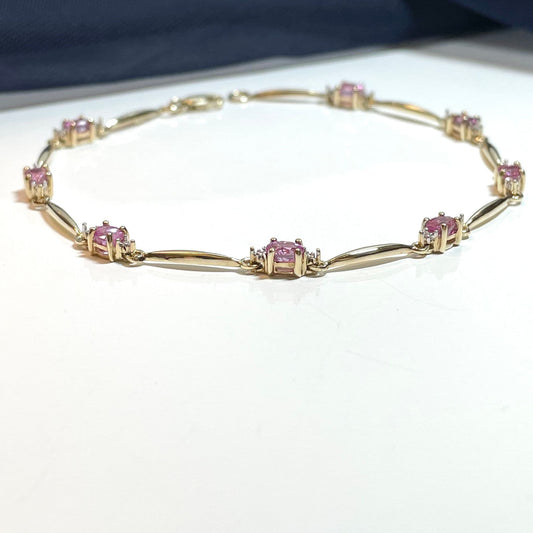 Pink sapphire and diamond yellow gold bracelet