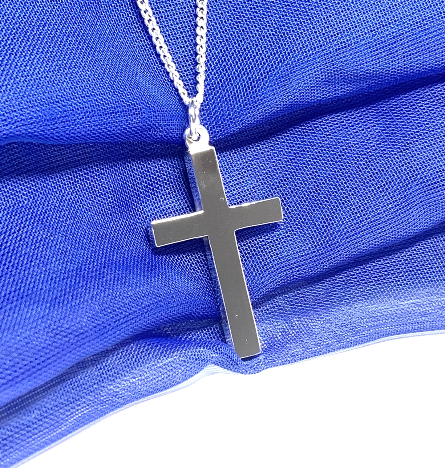 Polished plain heavy solid sterling silver cross on a curb chain