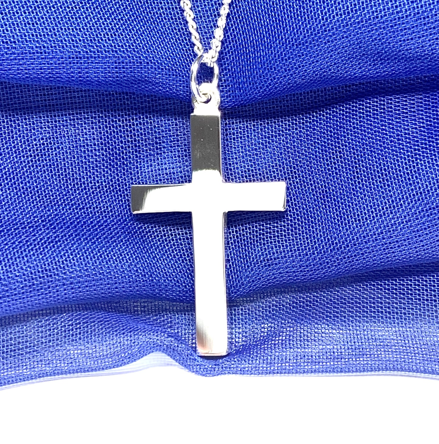 Polished plain heavy solid sterling silver cross on a curb chain