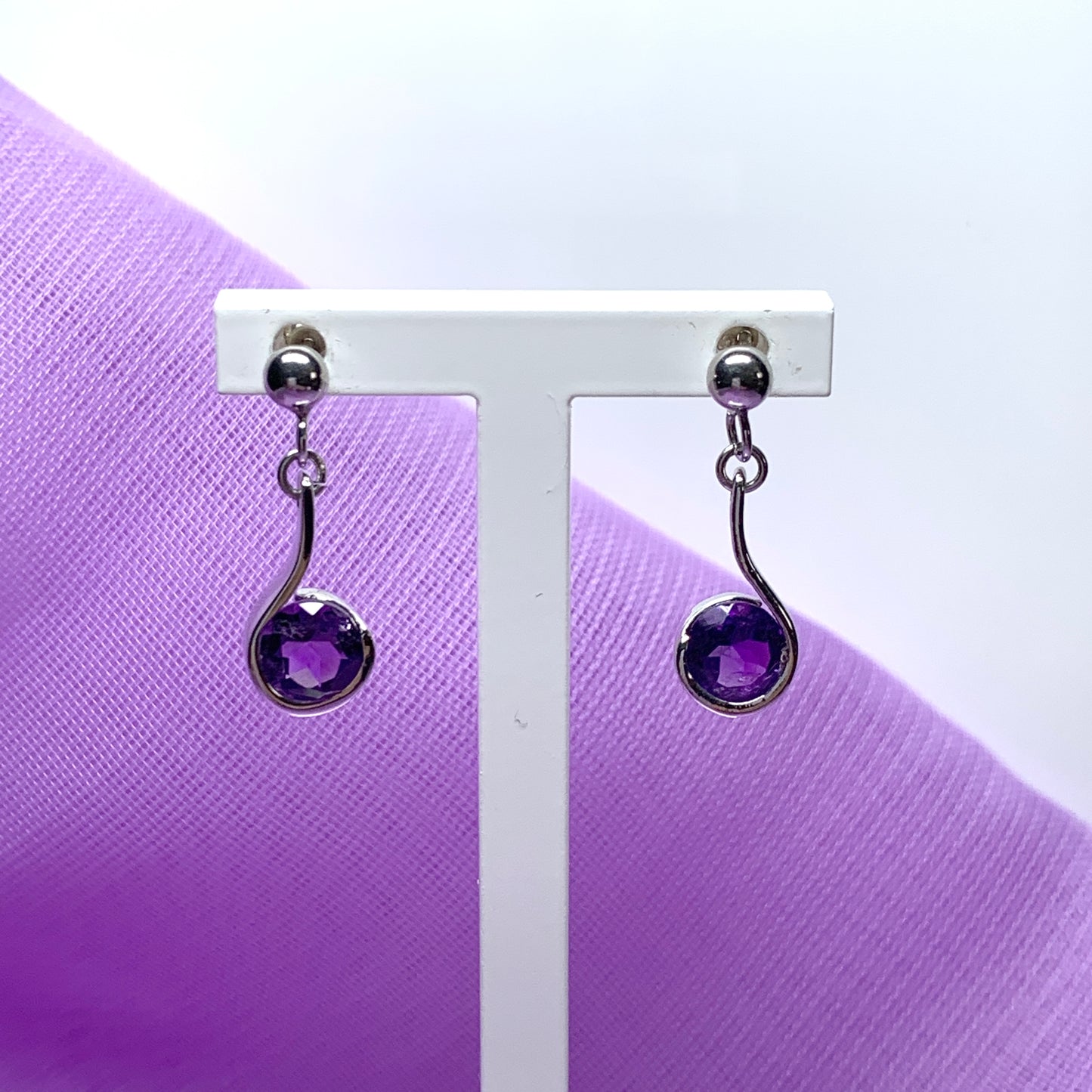 Purple amethyst white gold round drop swirl earrings