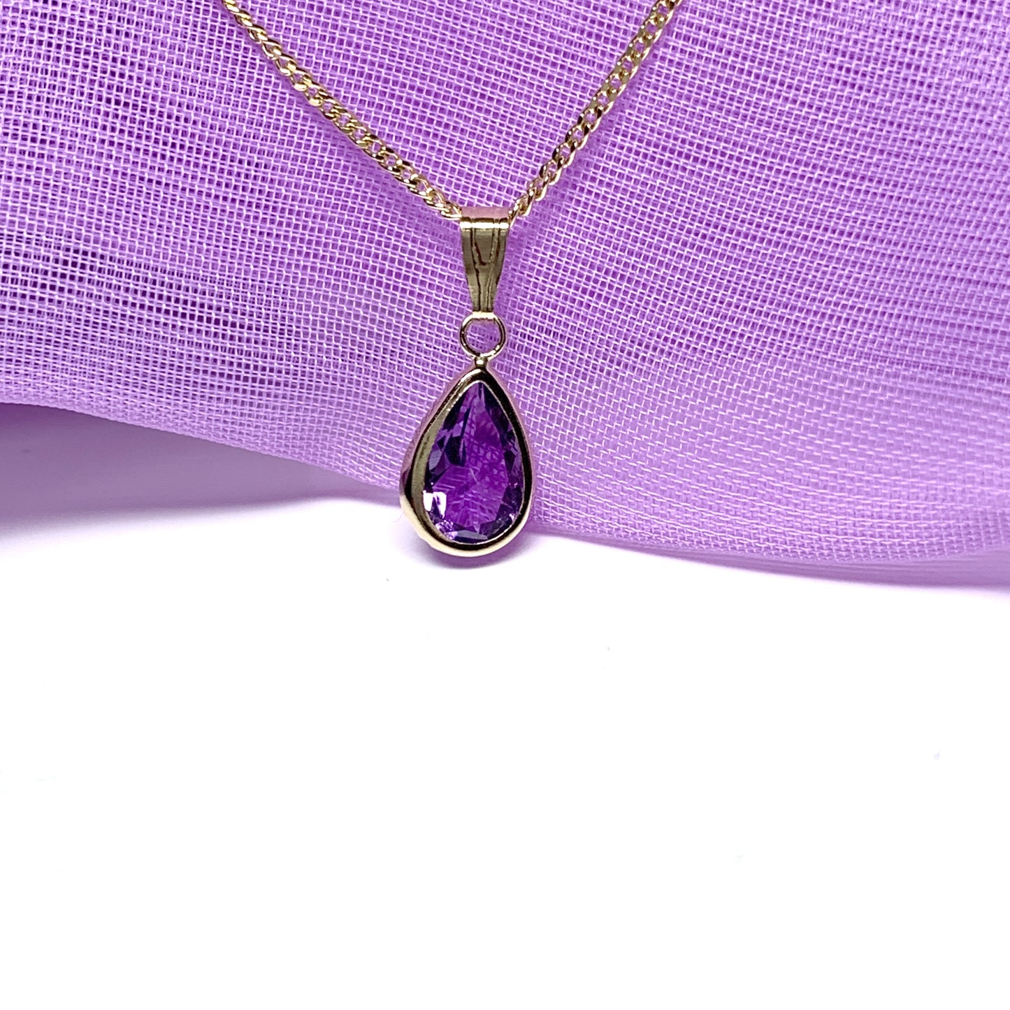 Purple amethyst pear shaped yellow gold necklace