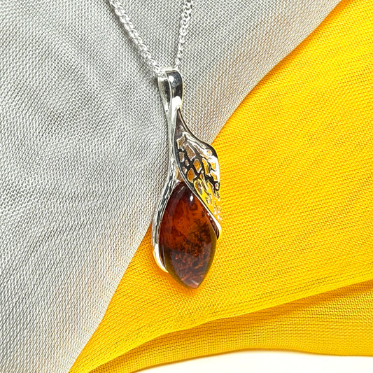 Real amber marquise sterling silver necklace with a swirl set fancy open pendant