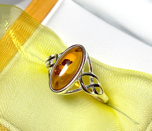 Real amber ring marquise shaped Celtic designed shoulders