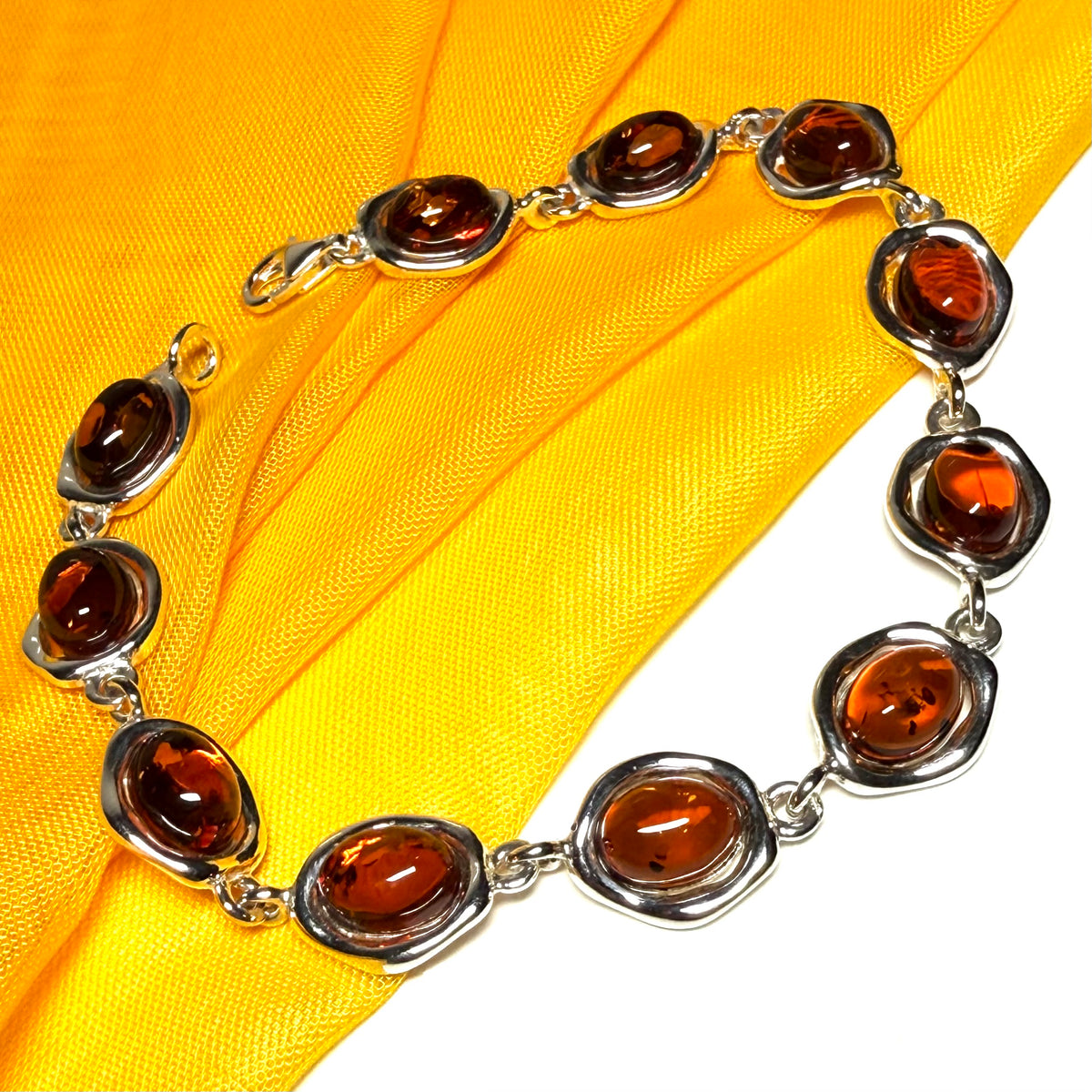 Real amber sterling silver fancy oval shaped bracelet