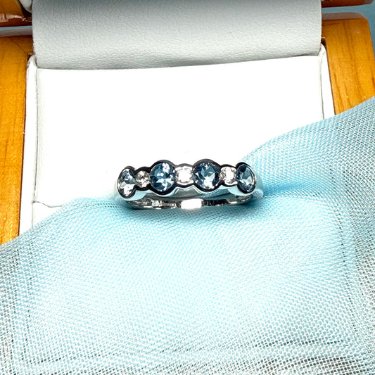 A real aquamarine and diamond white gold eternity ring