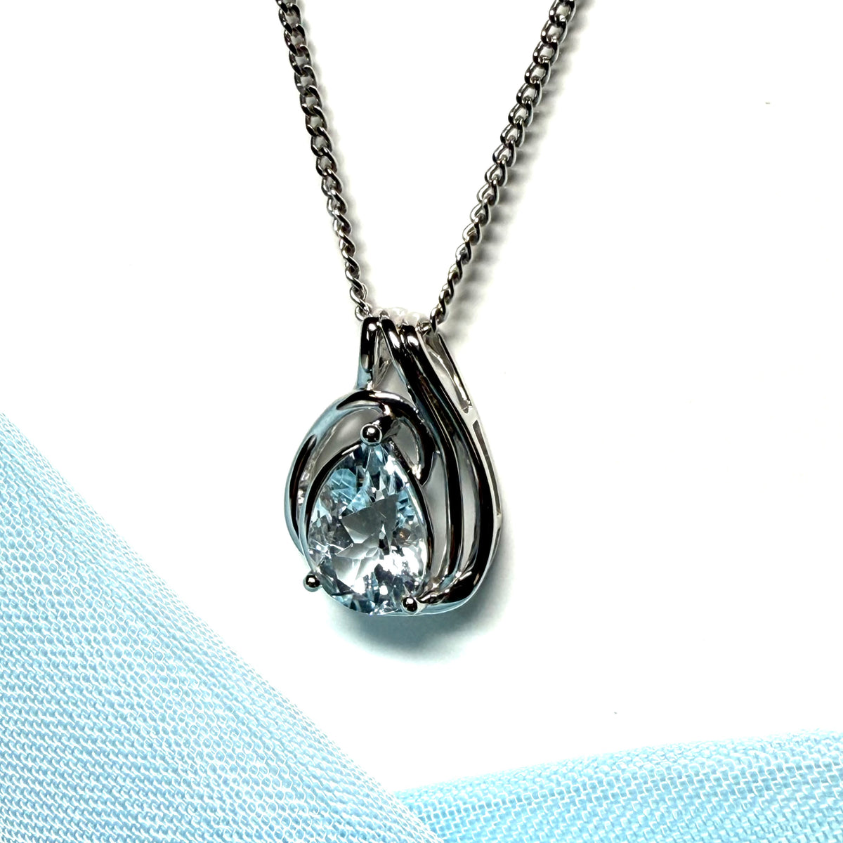 Real aquamarine white gold necklace swirl designed pear shaped stone