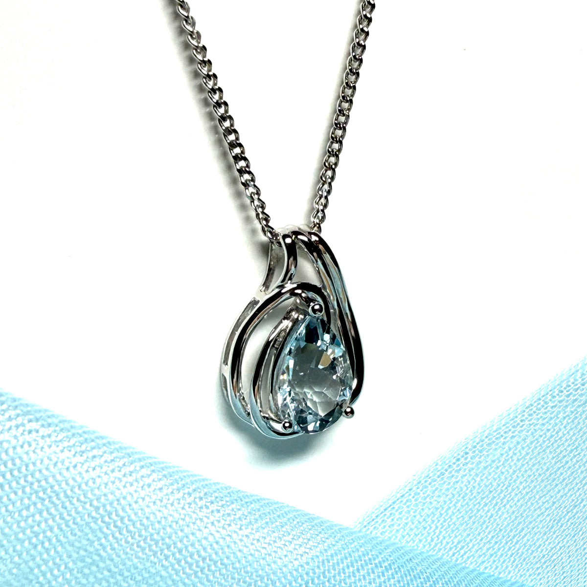 Real aquamarine white gold necklace swirl designed pear shaped stone