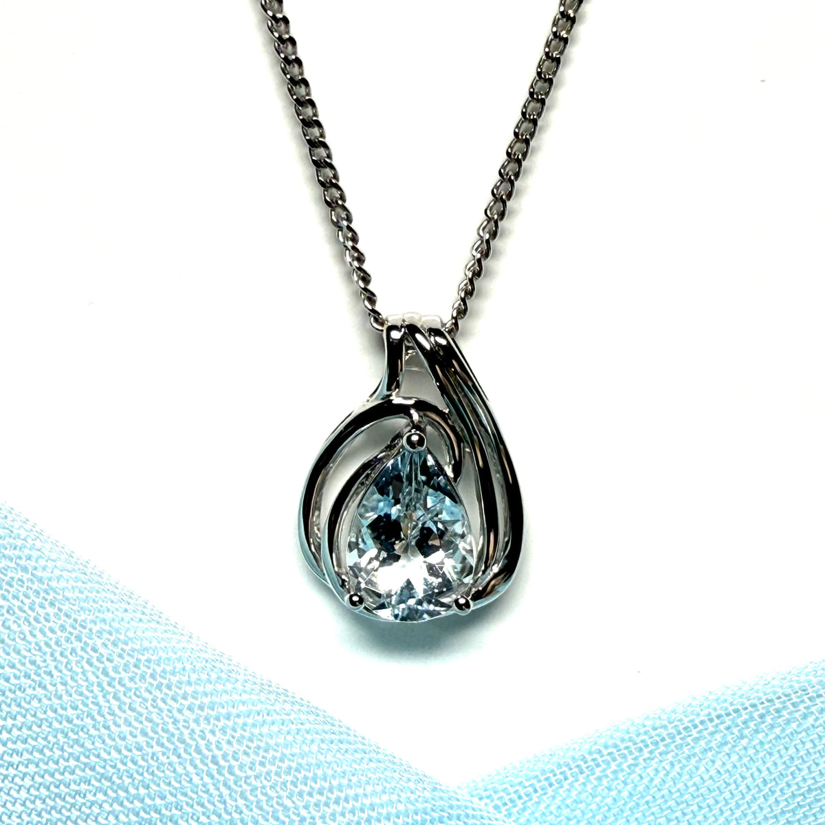Real aquamarine white gold necklace swirl designed pear shaped stone