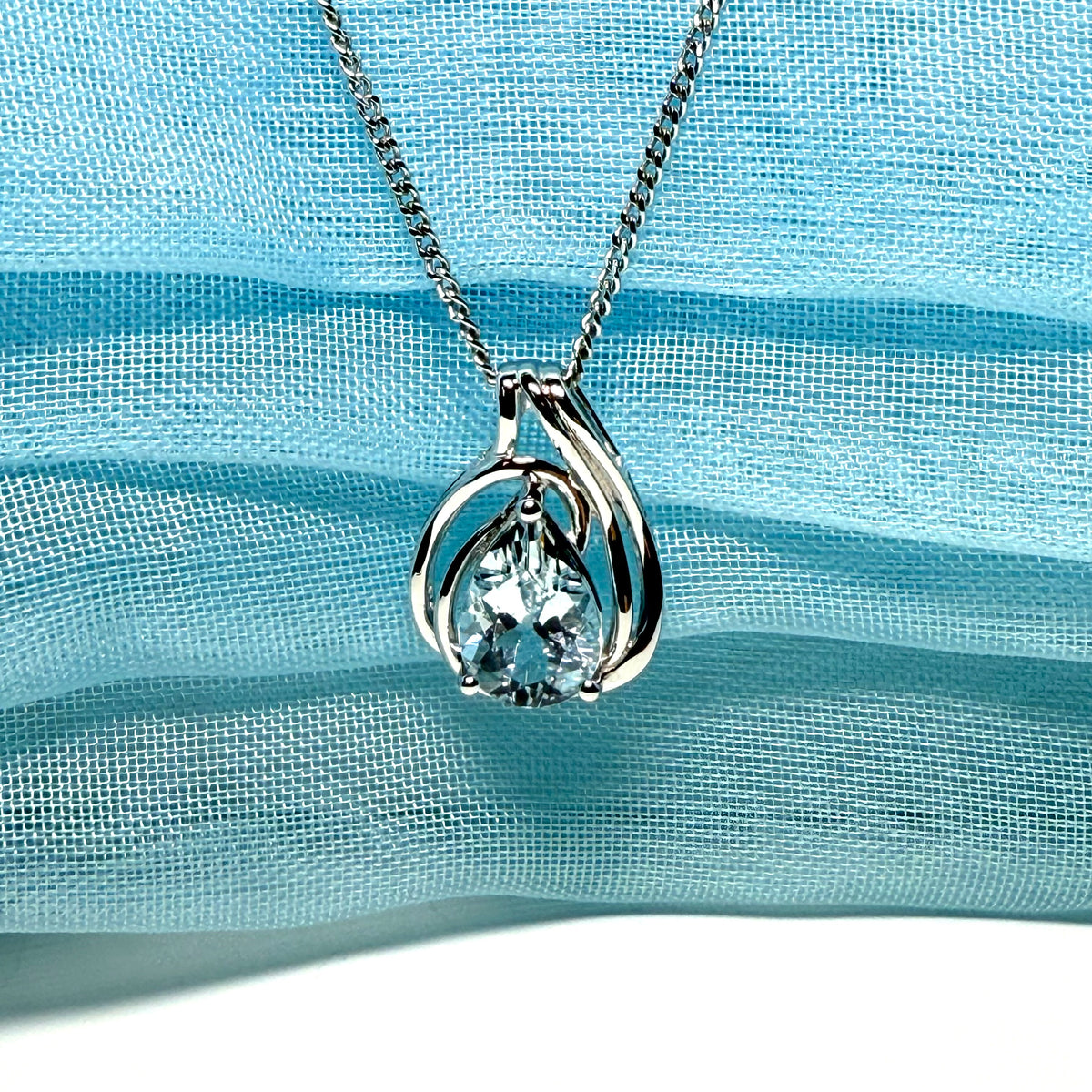 Real aquamarine white gold necklace swirl designed pear shaped stone