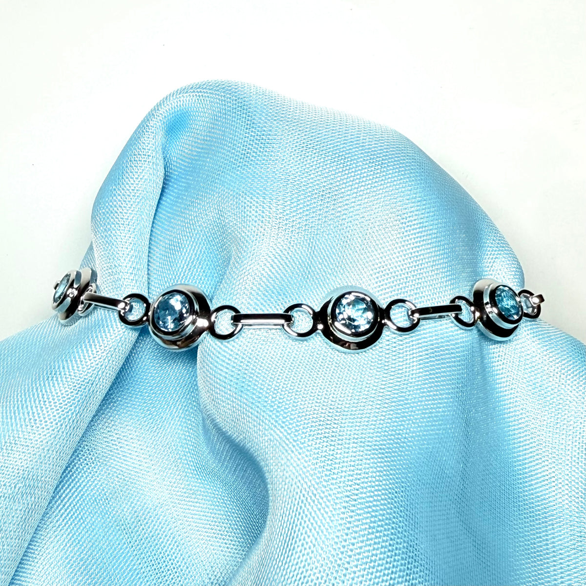Real blue topaz fancy round link sterling silver bracelet