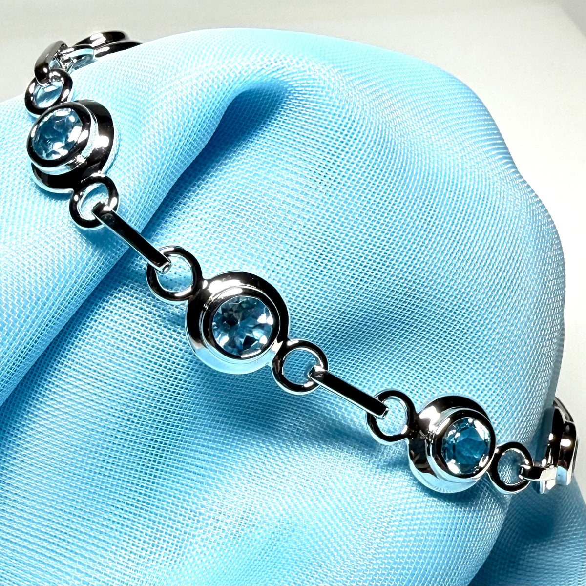 Real blue topaz fancy round link sterling silver bracelet