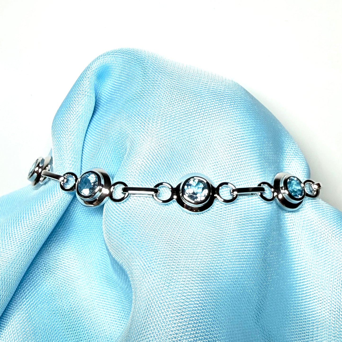 Real blue topaz fancy round link sterling silver bracelet