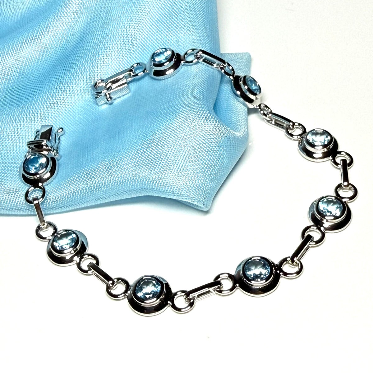 Real blue topaz fancy round link sterling silver bracelet