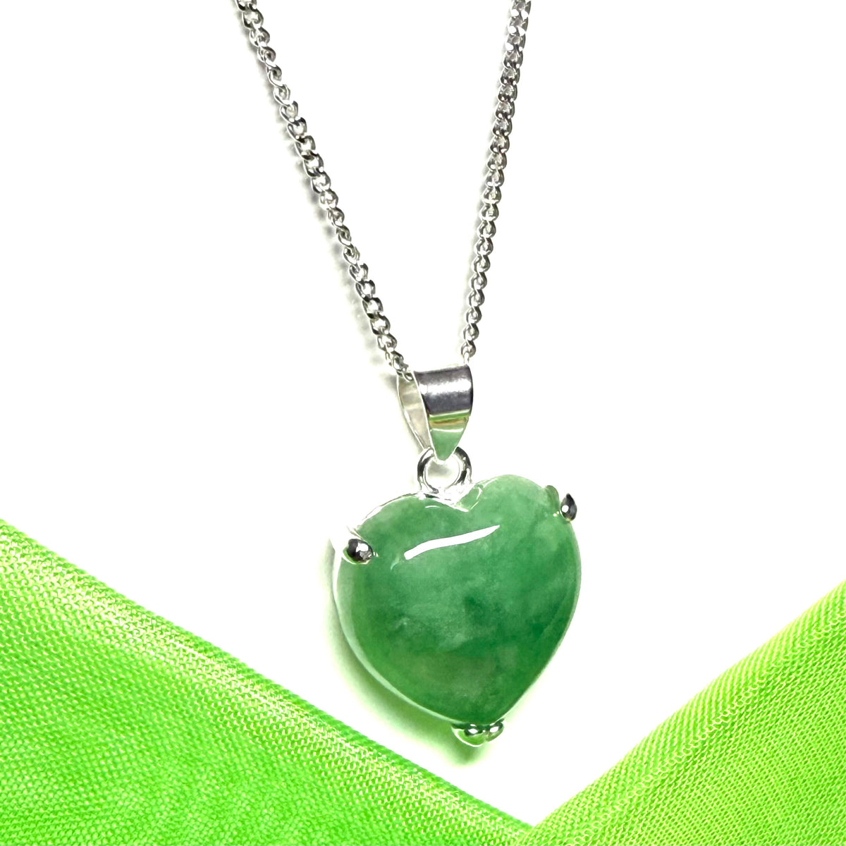 A real dark green jade pendant necklace heart shape sterling silver with a chain included