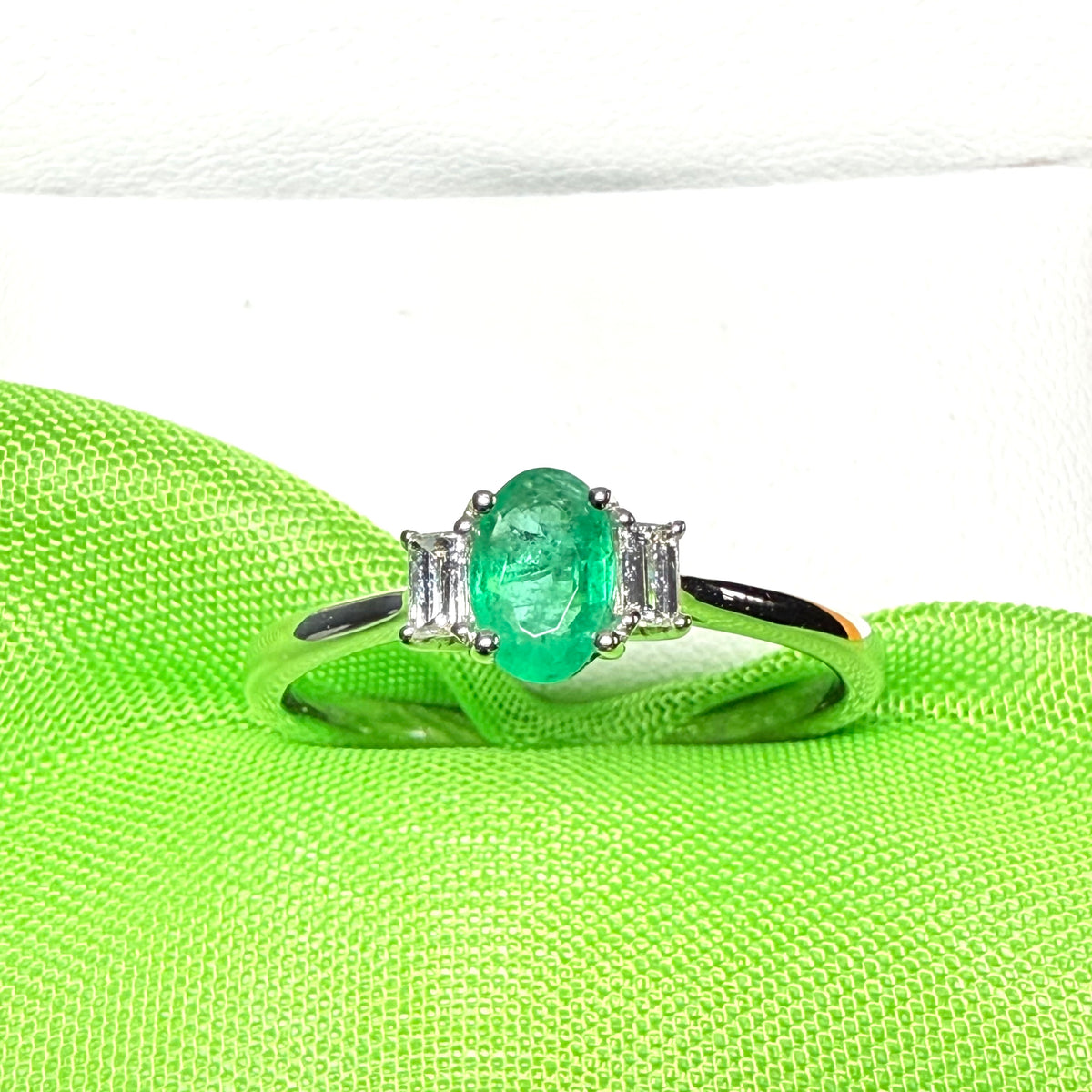 Real emerald and diamond three stone trilogy ring white gold
