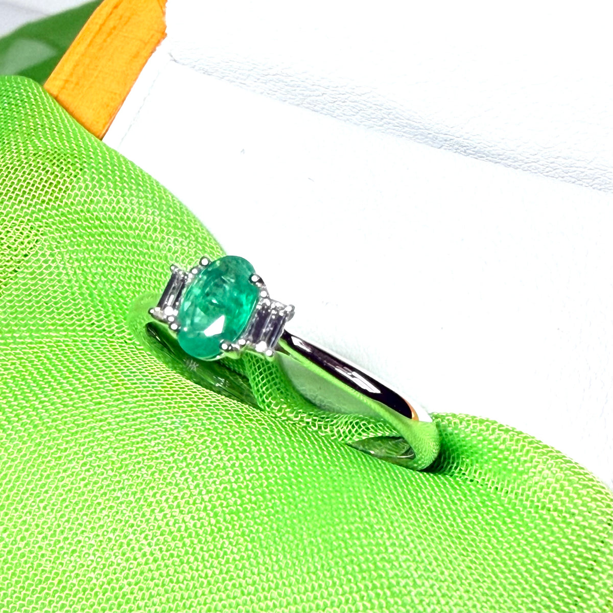 Real emerald and diamond three stone trilogy ring white gold