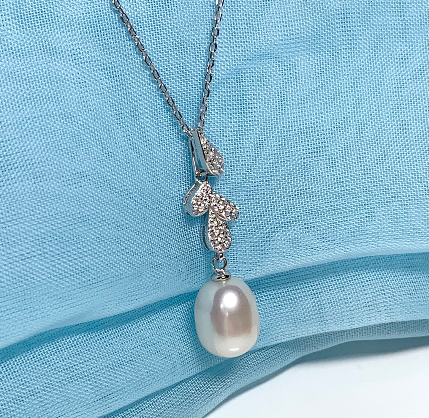 Real freshwater cultured pearl necklace pendant with cubic zirconia stones above