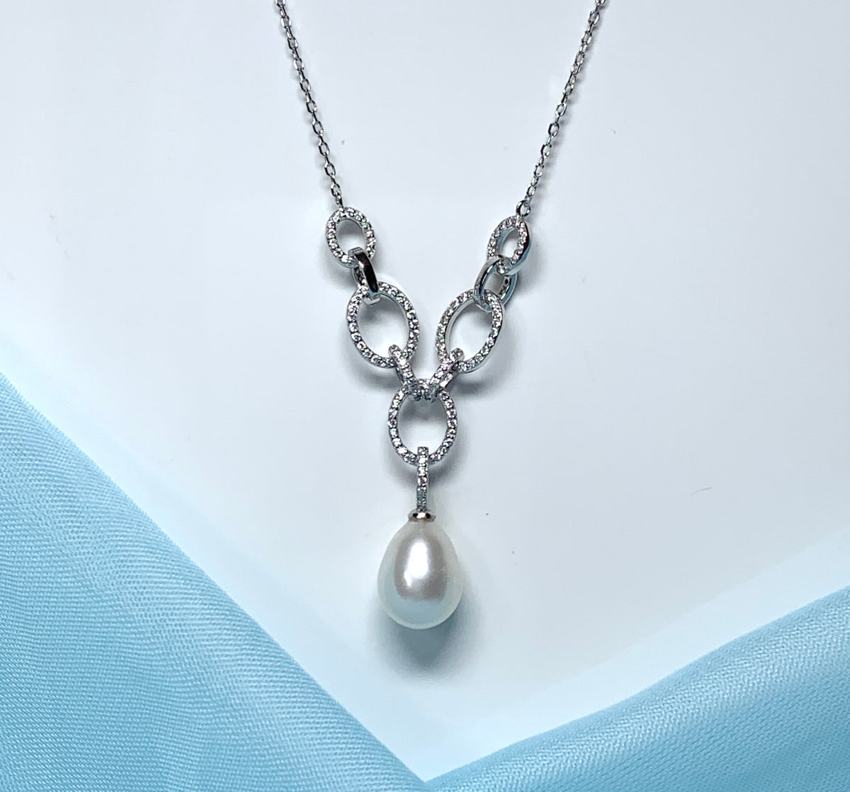 Real freshwater cultured pearl necklace chain links cubic zirconia stones above the pendant