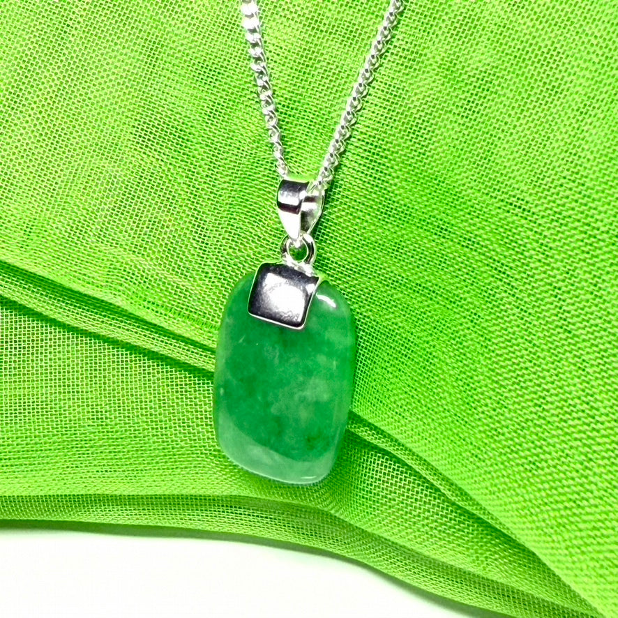 Real green jade necklace having a cushion shaped stone sterling silver with a chain included