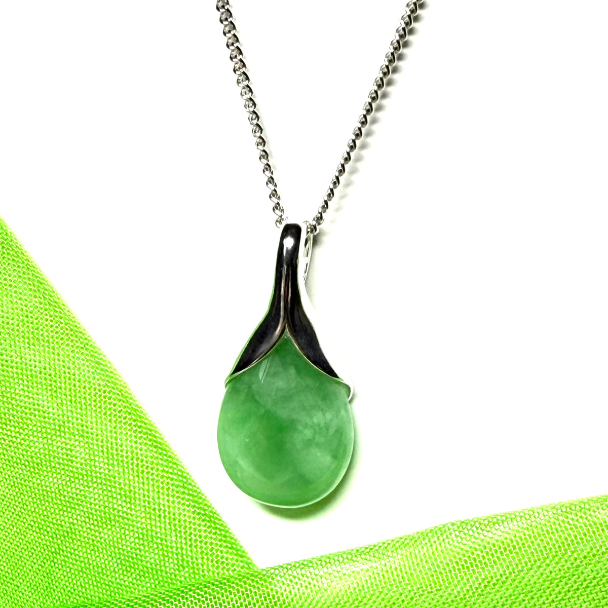 Real green jade necklace in a pear or tear drop shaped sterling silver pendant with chain