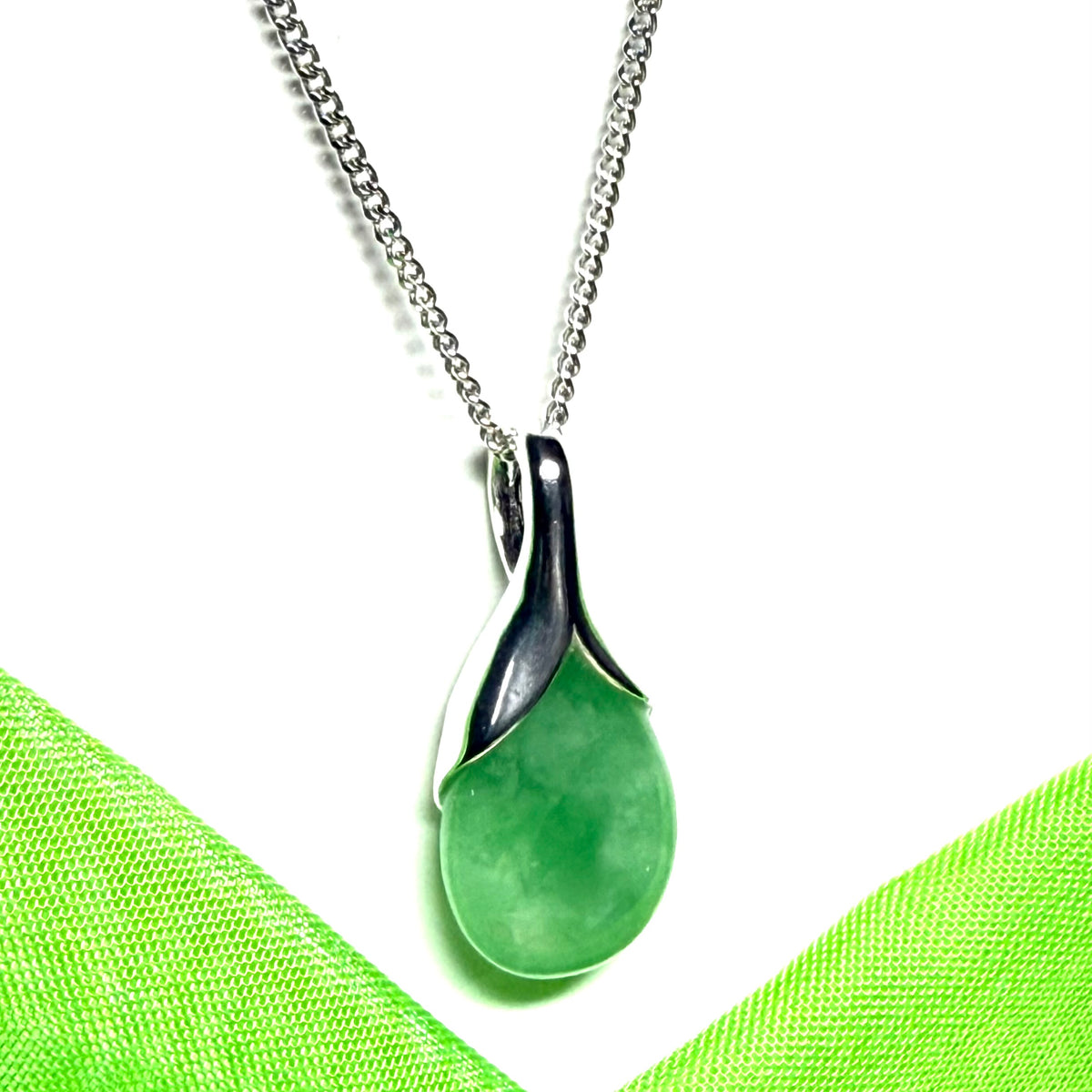 Real green jade necklace in a pear or tear drop shaped sterling silver pendant with chain