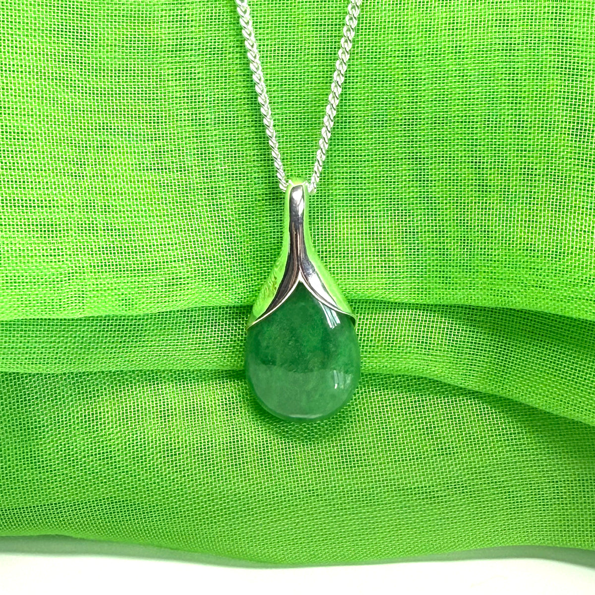 Real green jade necklace in a pear shaped sterling silver
