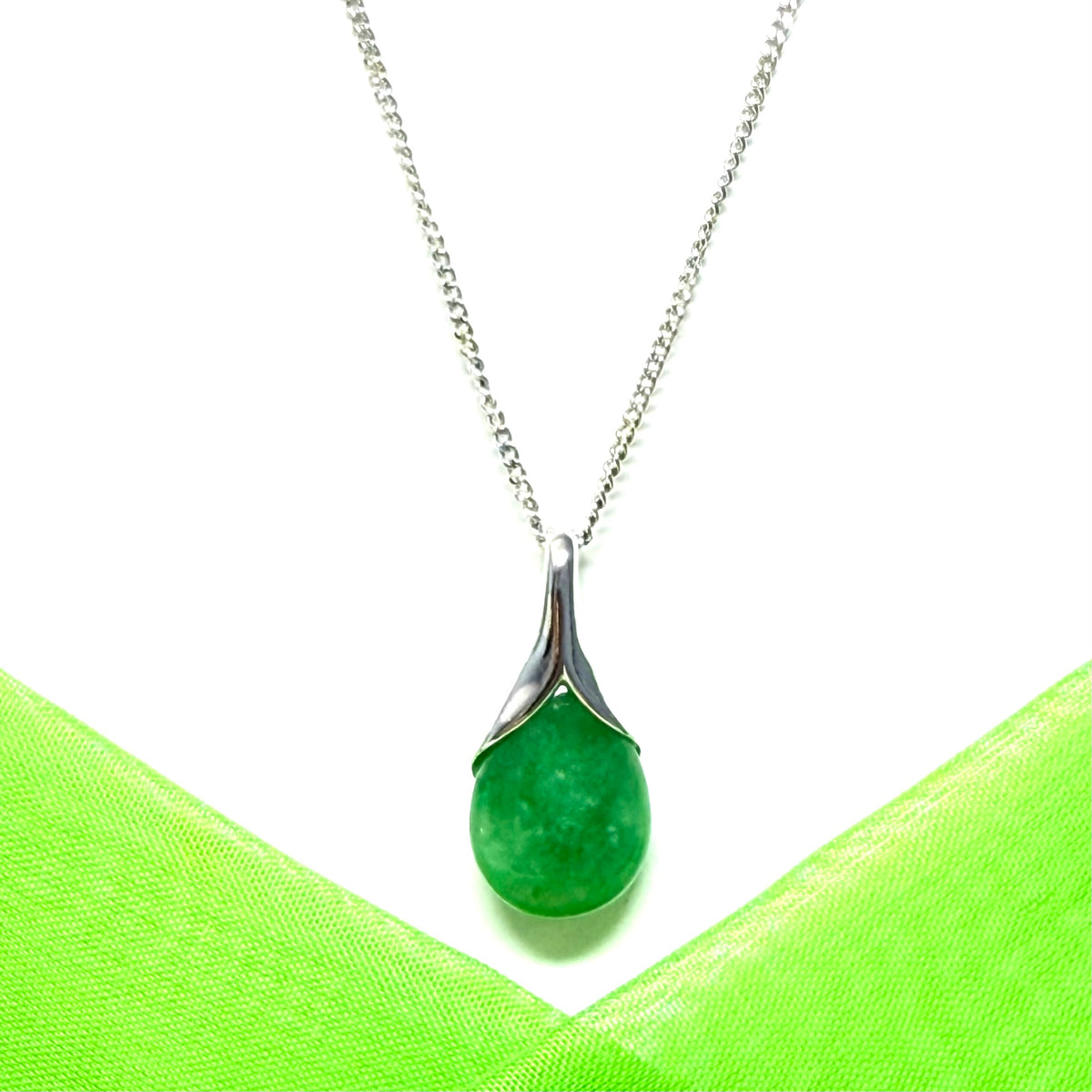 Real green jade necklace in a teardrop or pear shaped, a timeless designed pendant with a chain