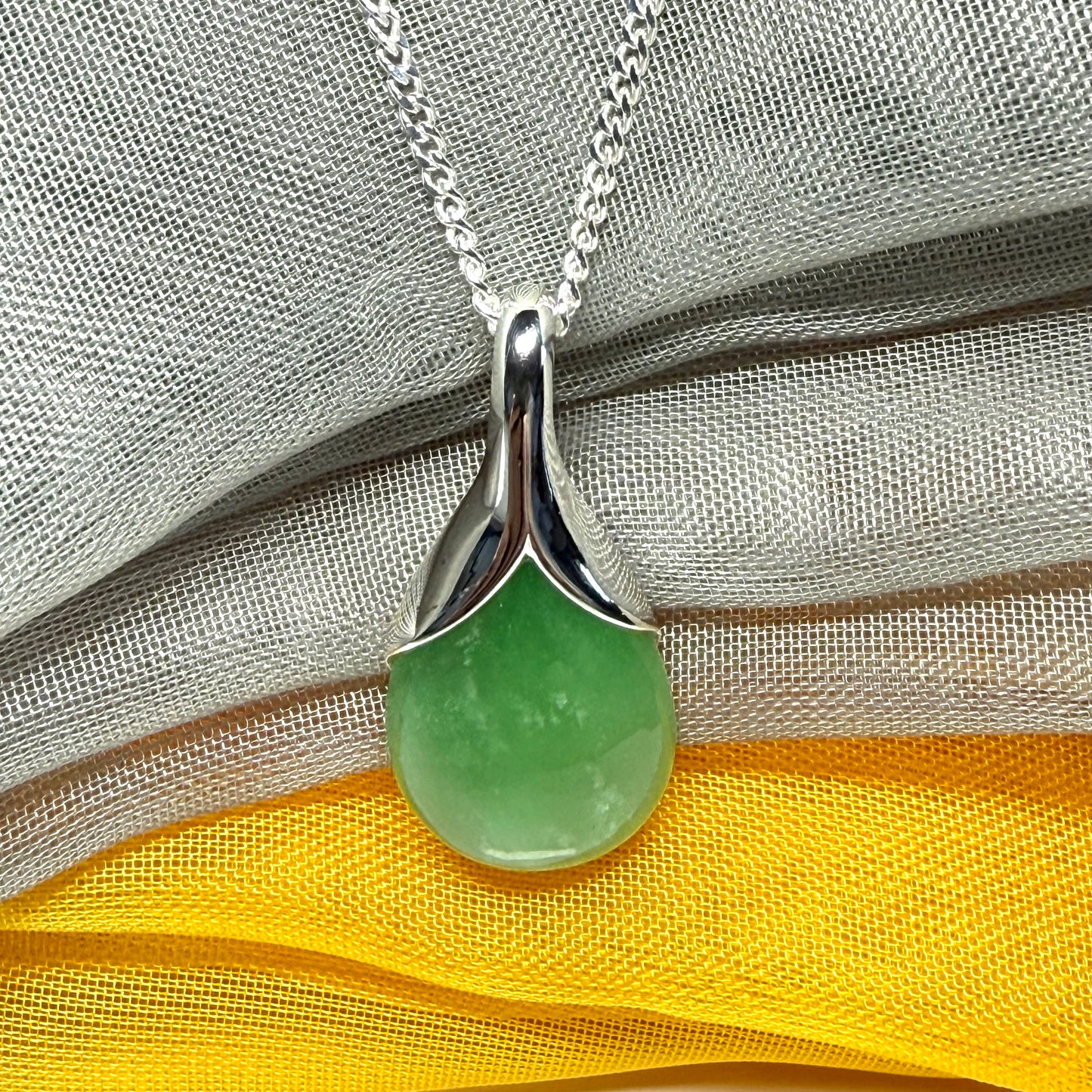 Real green jade necklace in a teardrop or pear shaped, simply stunning