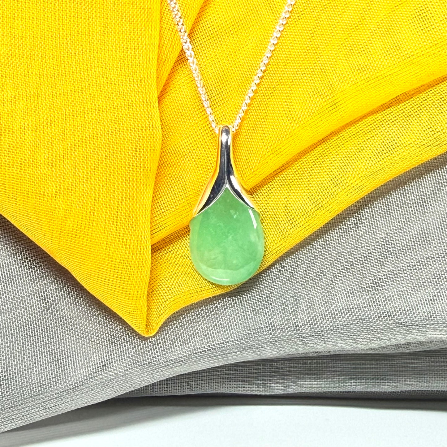 Real green jade necklace in a teardrop shaped or pear shaped, beautiful pendant