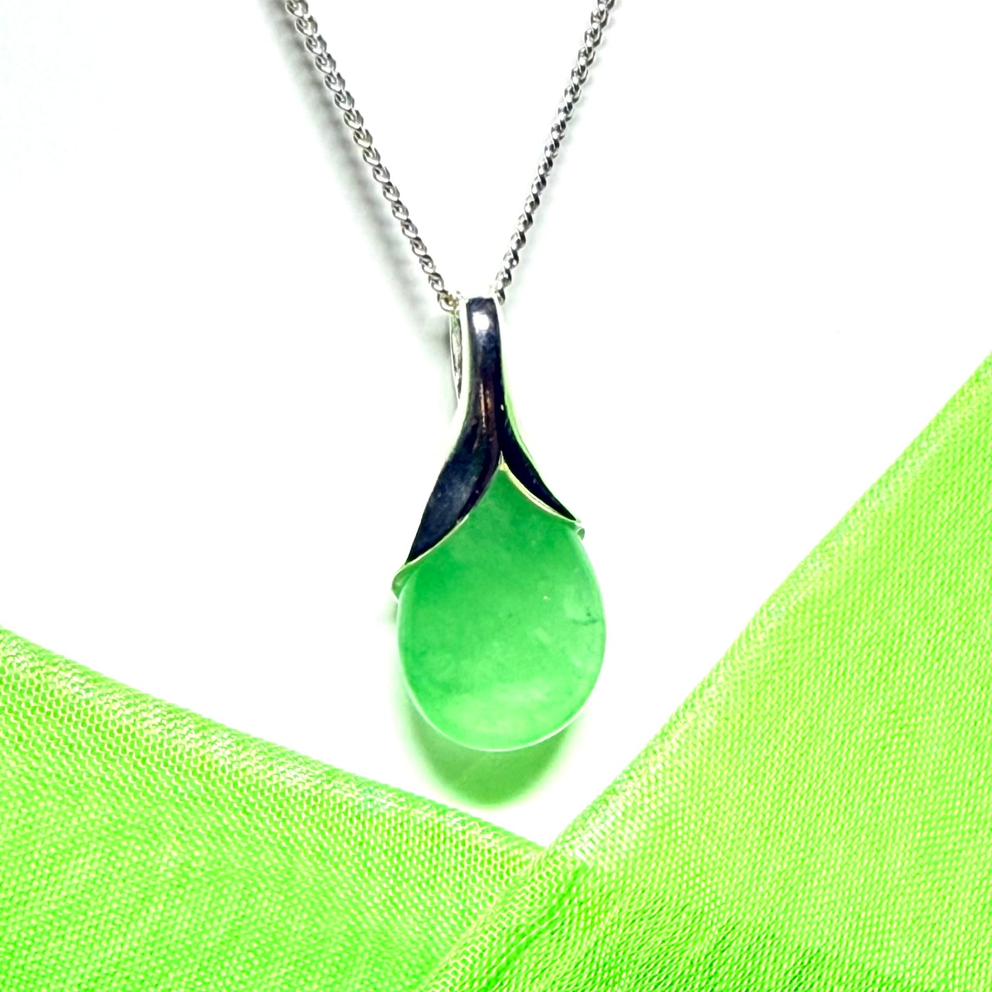 Real green jade necklace in a teardrop or pear shaped, a timeless designed pendant with a chain included
