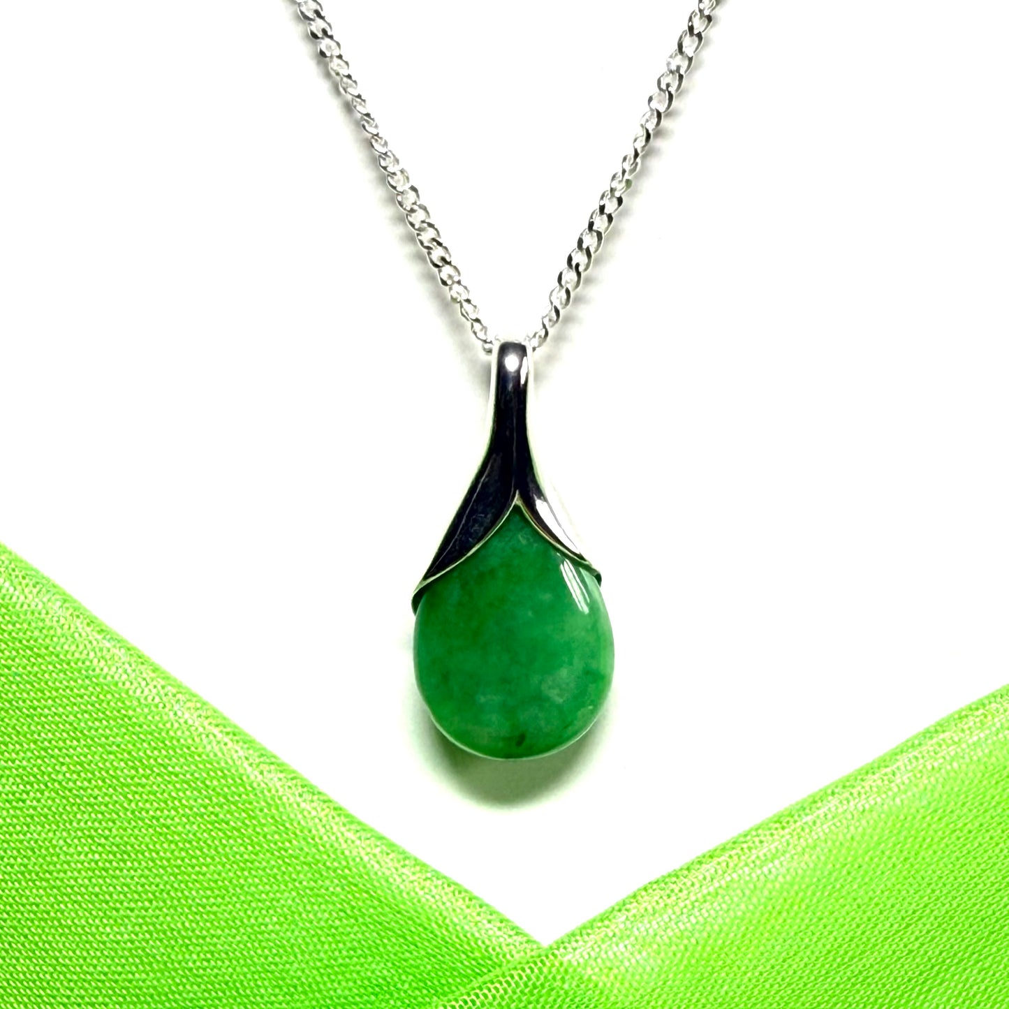 Real green jade tear drop dotted sterling silver pear shaped pendant including a solid chain