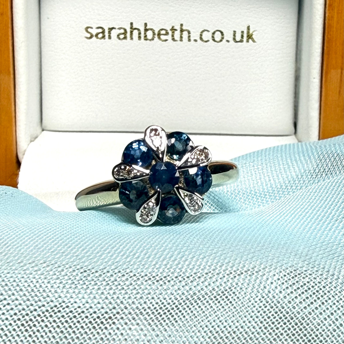 Real light blue sapphire and real diamond round cluster ring yellow gold