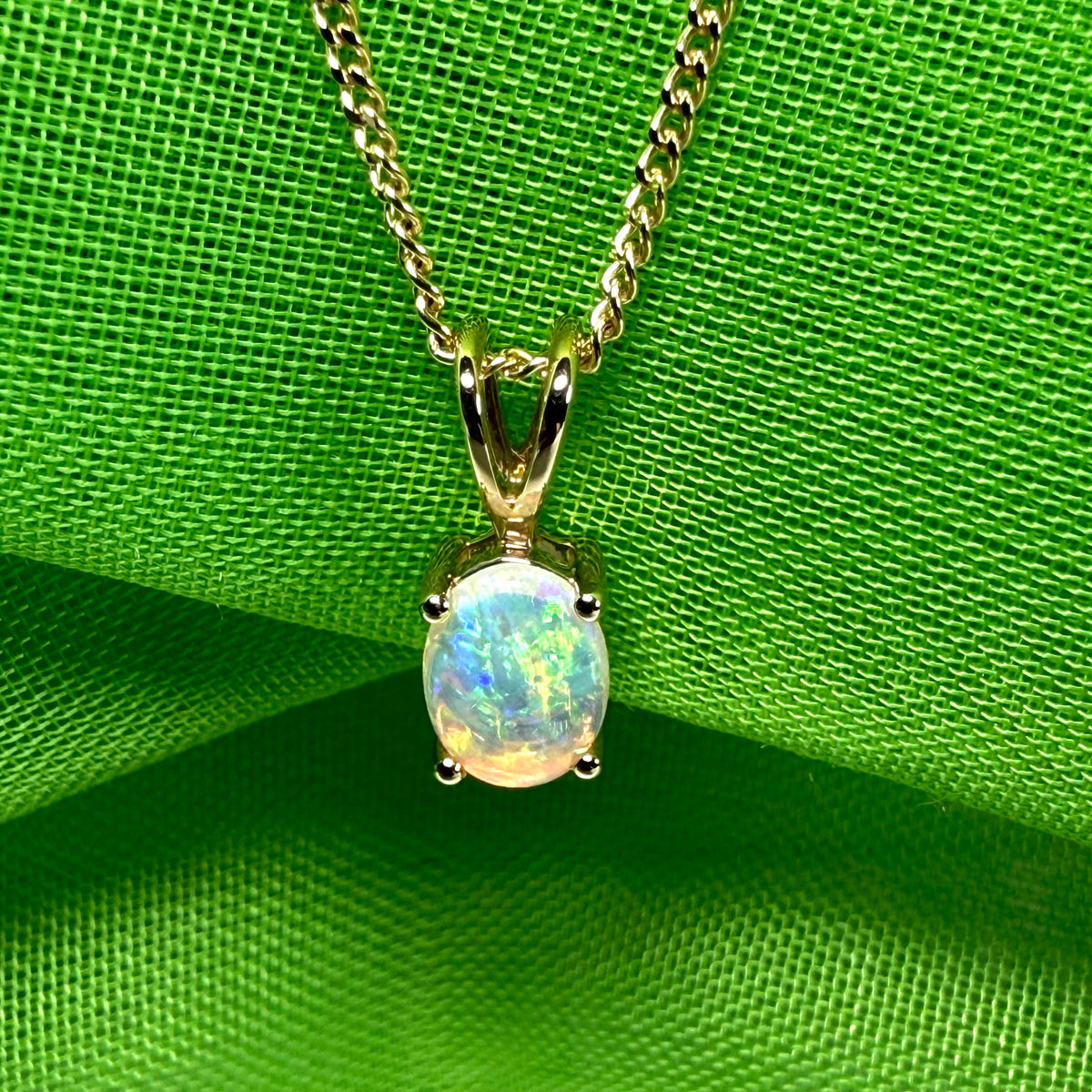Real opal pendant oval cut yellow gold