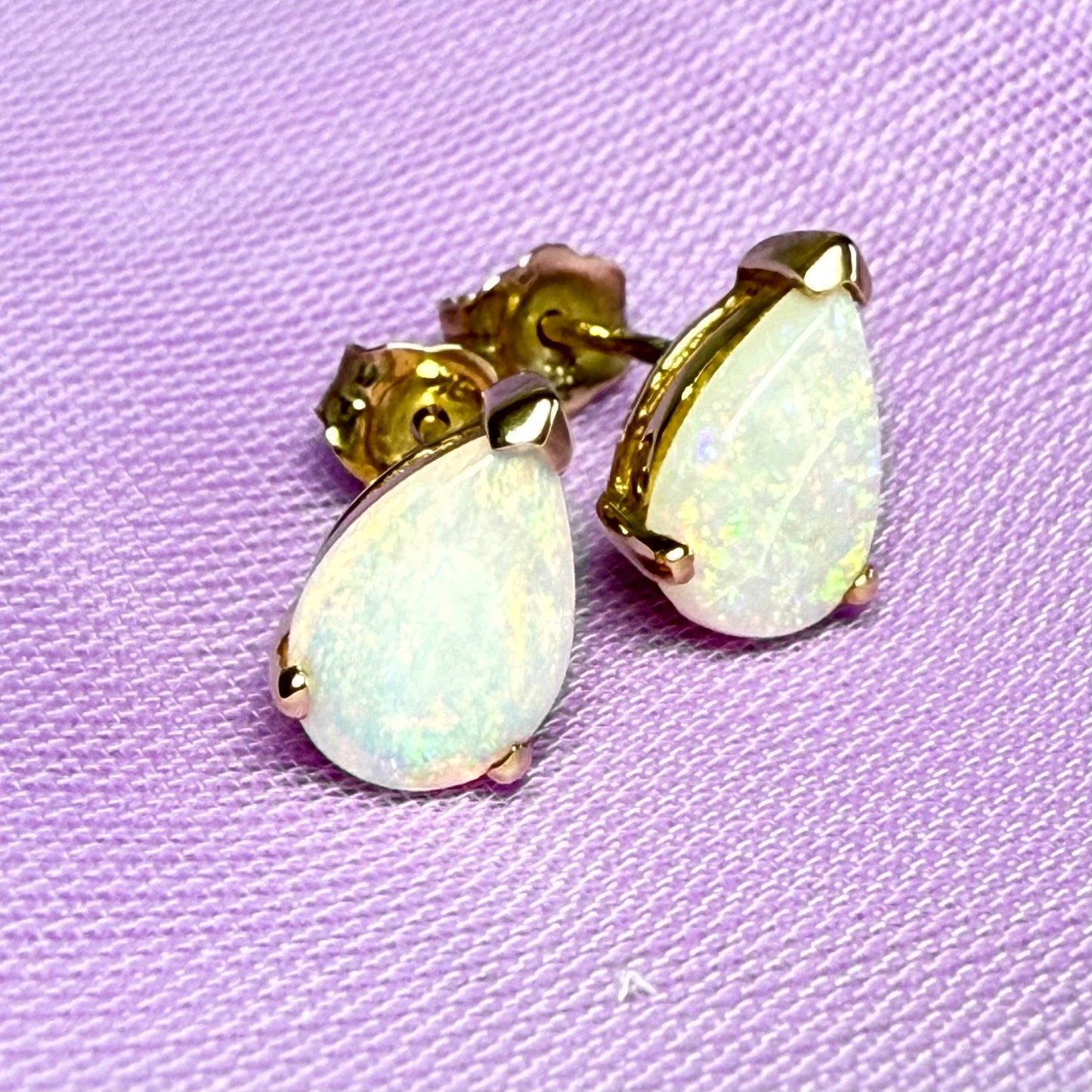 Real opal stud earrings Yellow gold claw setting with teardrop stones