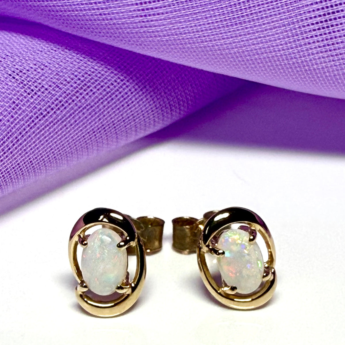 Real opal yellow gold fancy oval stud earrings