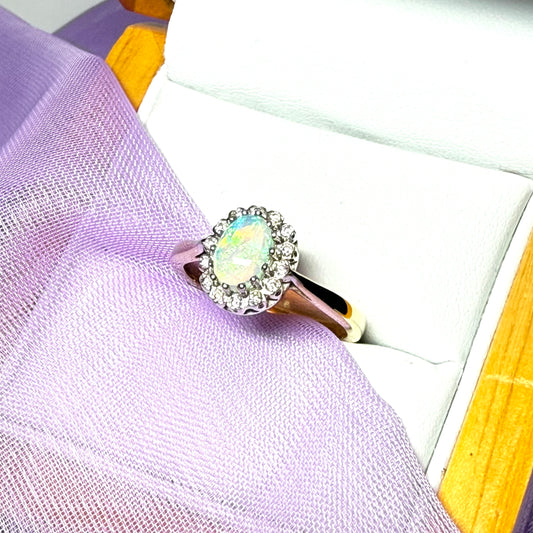 Real oval opal and diamond yellow gold cluster ring