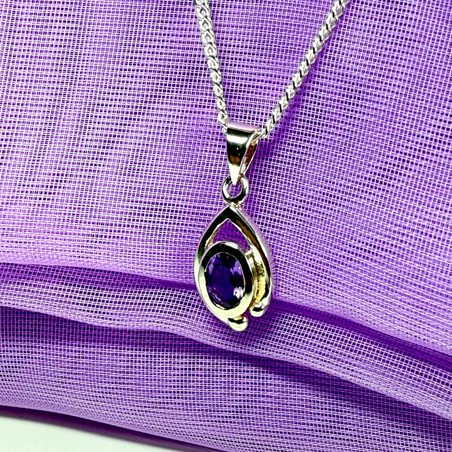 Real purple amethyst oval shaped sterling silver necklace with a smooth rubbed over pierced pendant with chain