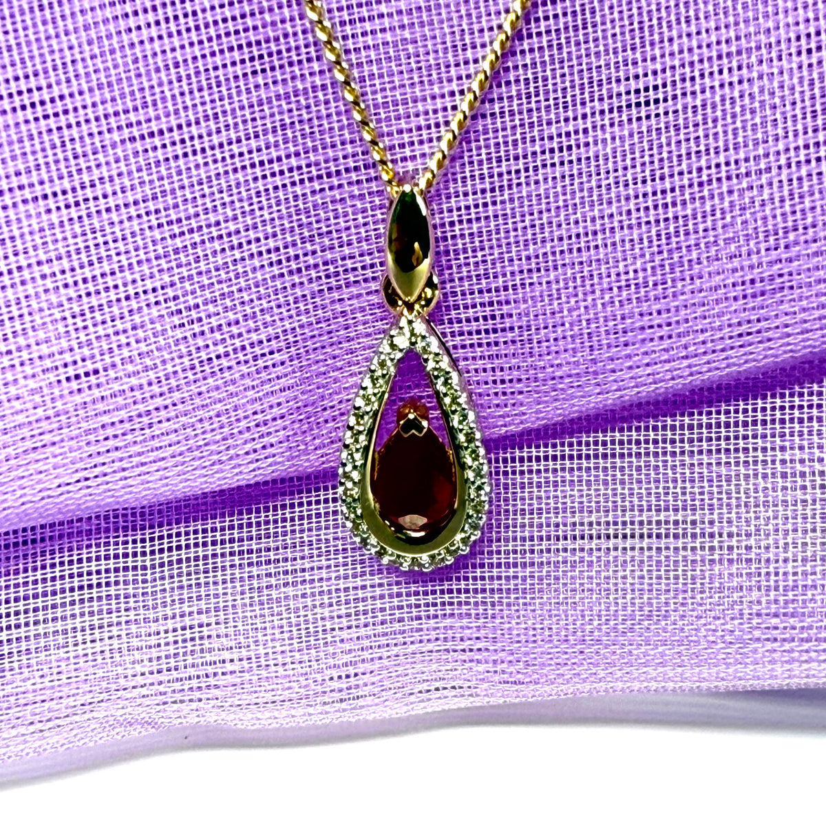 Real red pear shaped ruby and diamond pierced necklace yellow gold