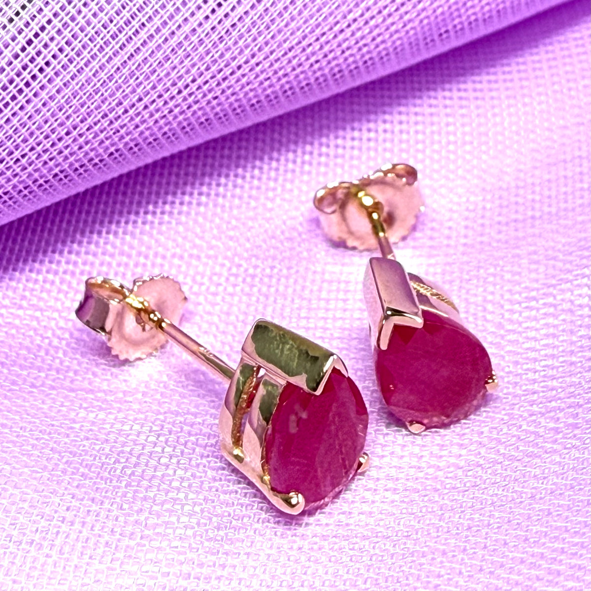 Real ruby yellow gold pear shaped stud earrings