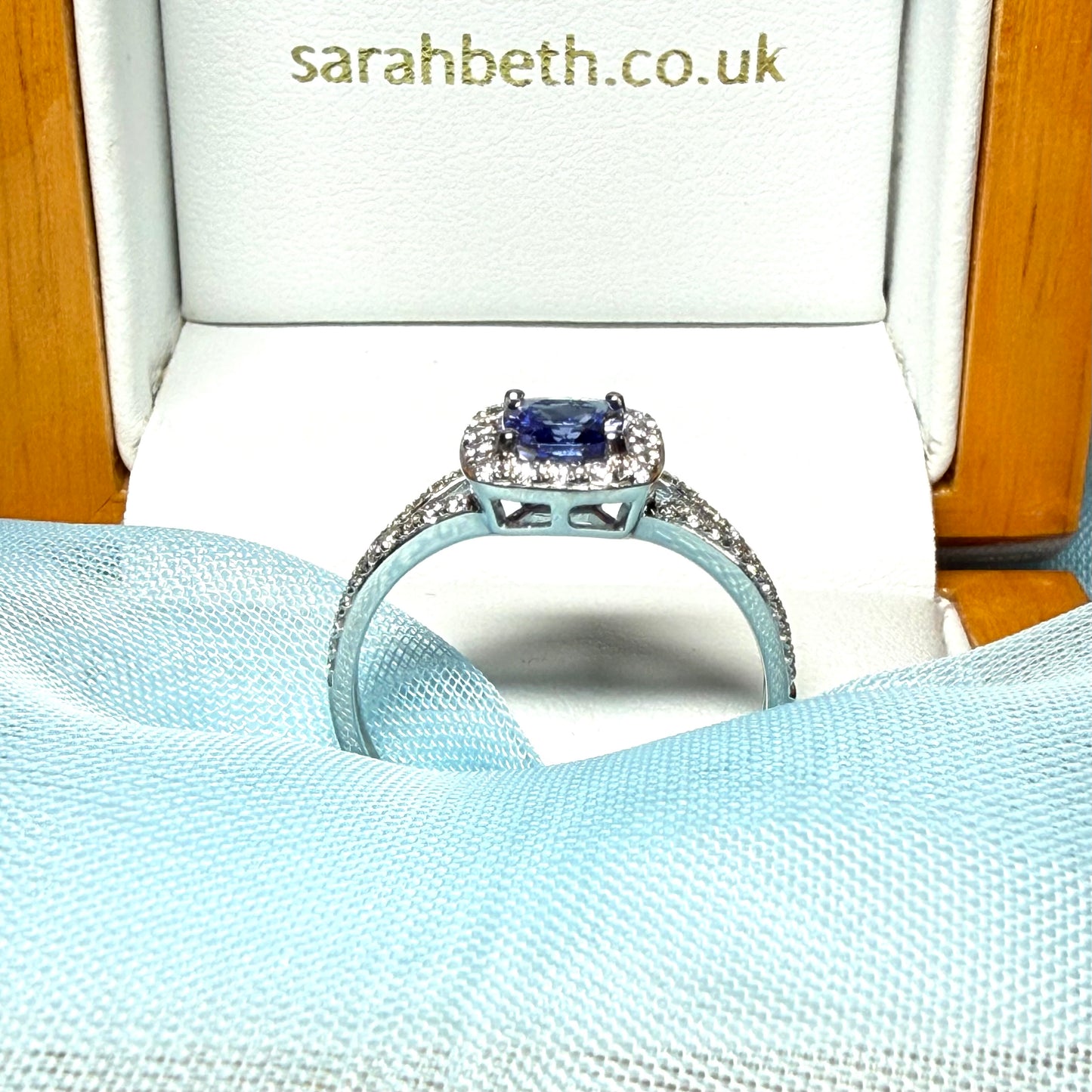 Real tanzanite and diamond white gold square cluster ring split shoulders cushion shape