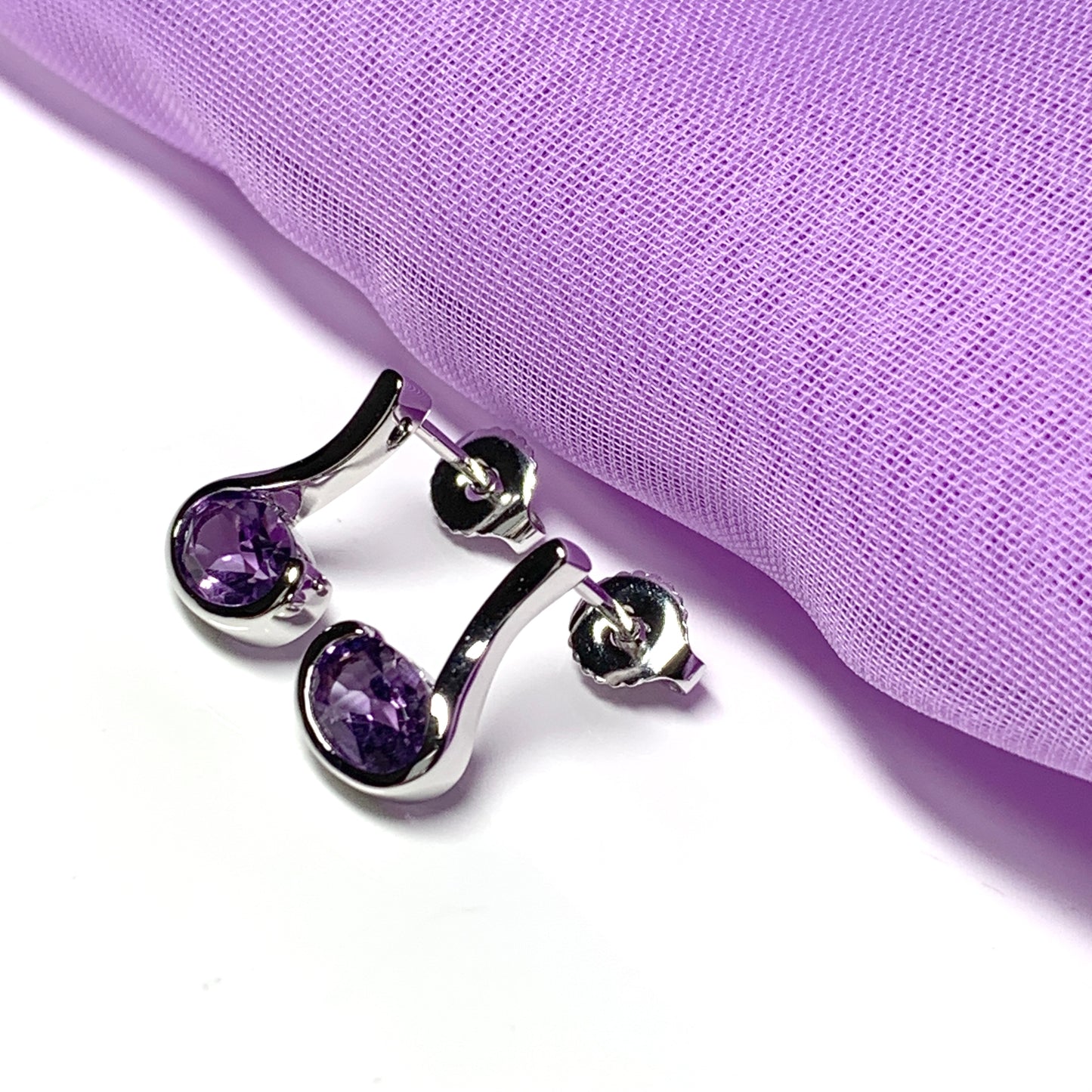 Real amethyst earrings fancy purple stud swirl