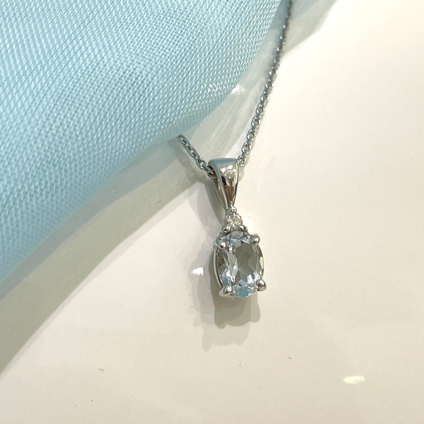 Real aquamarine necklace and diamond oval shaped white gold pendant