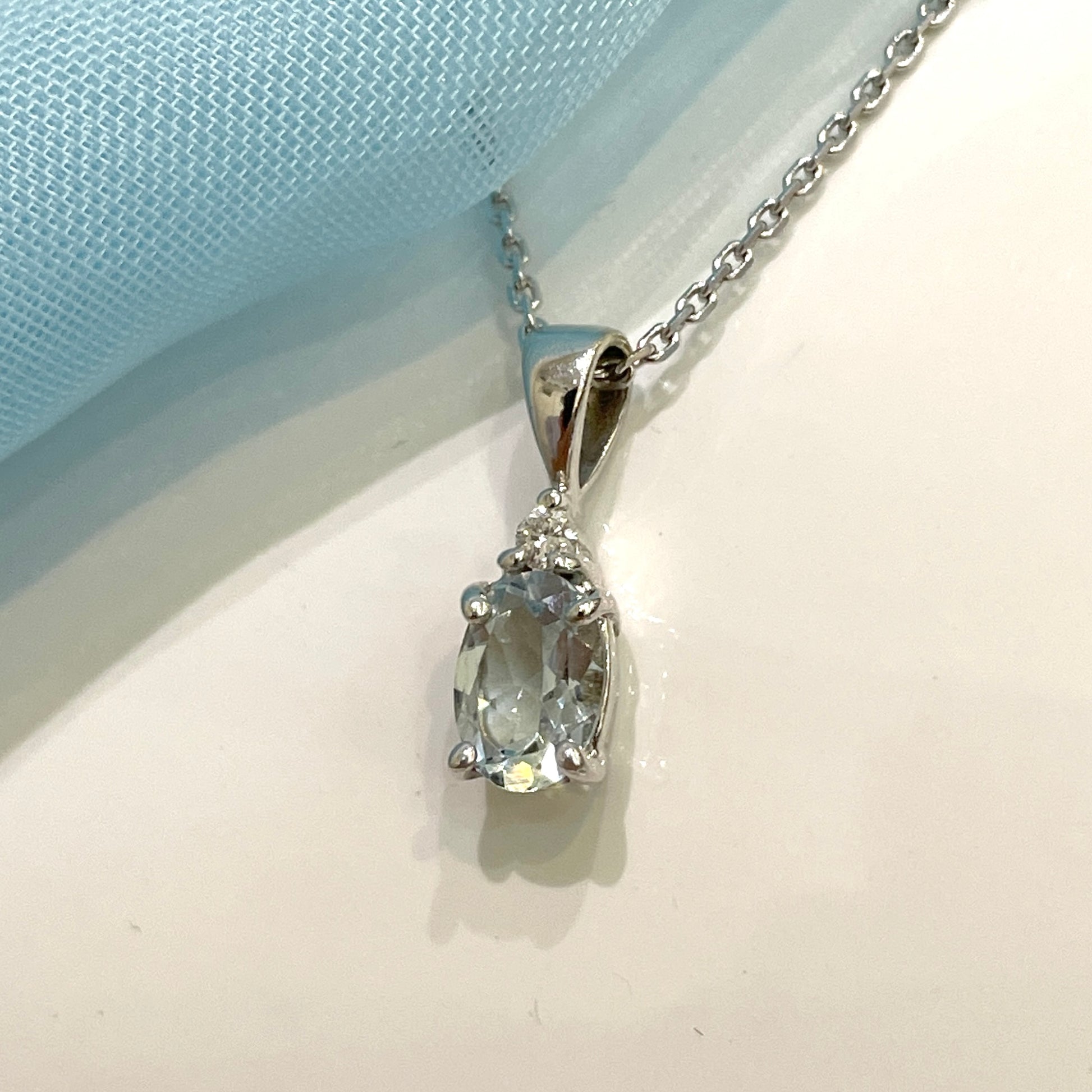 Real aquamarine necklace and diamond oval shaped white gold pendant
