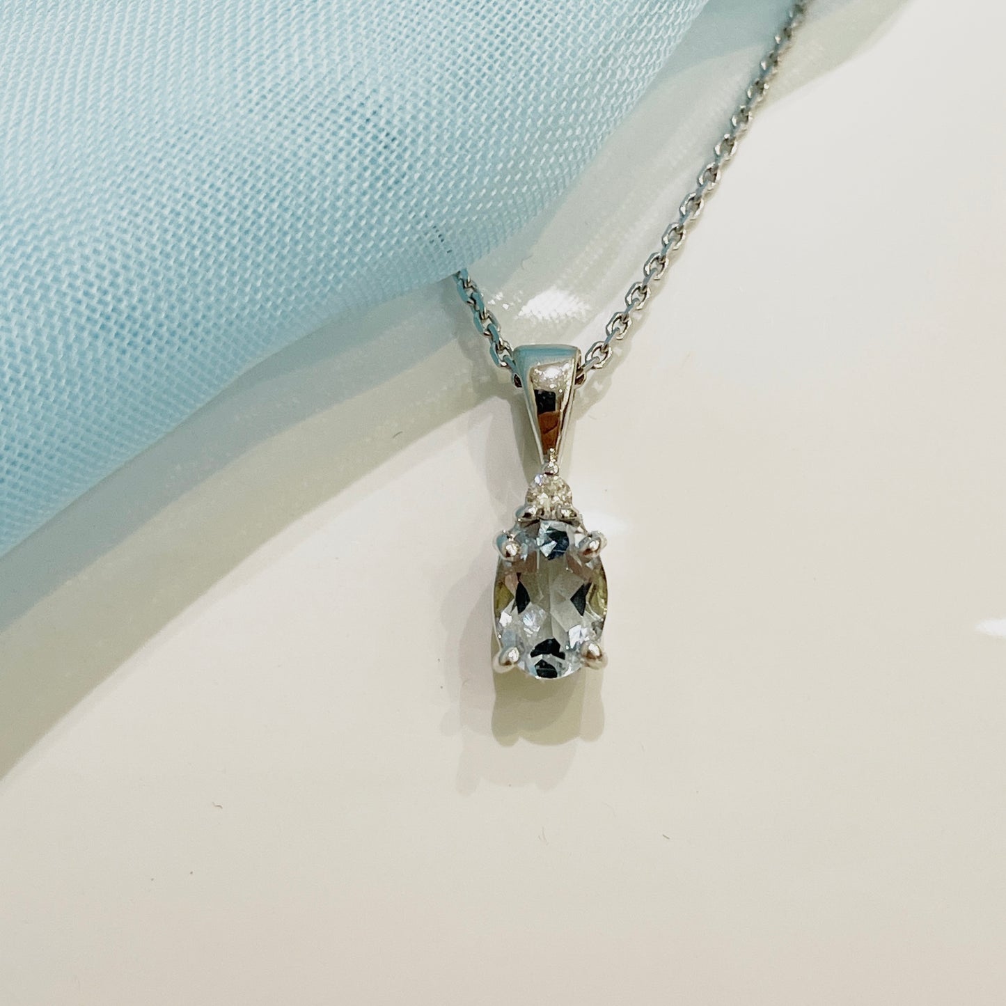 Real aquamarine necklace and diamond oval shaped white gold pendant