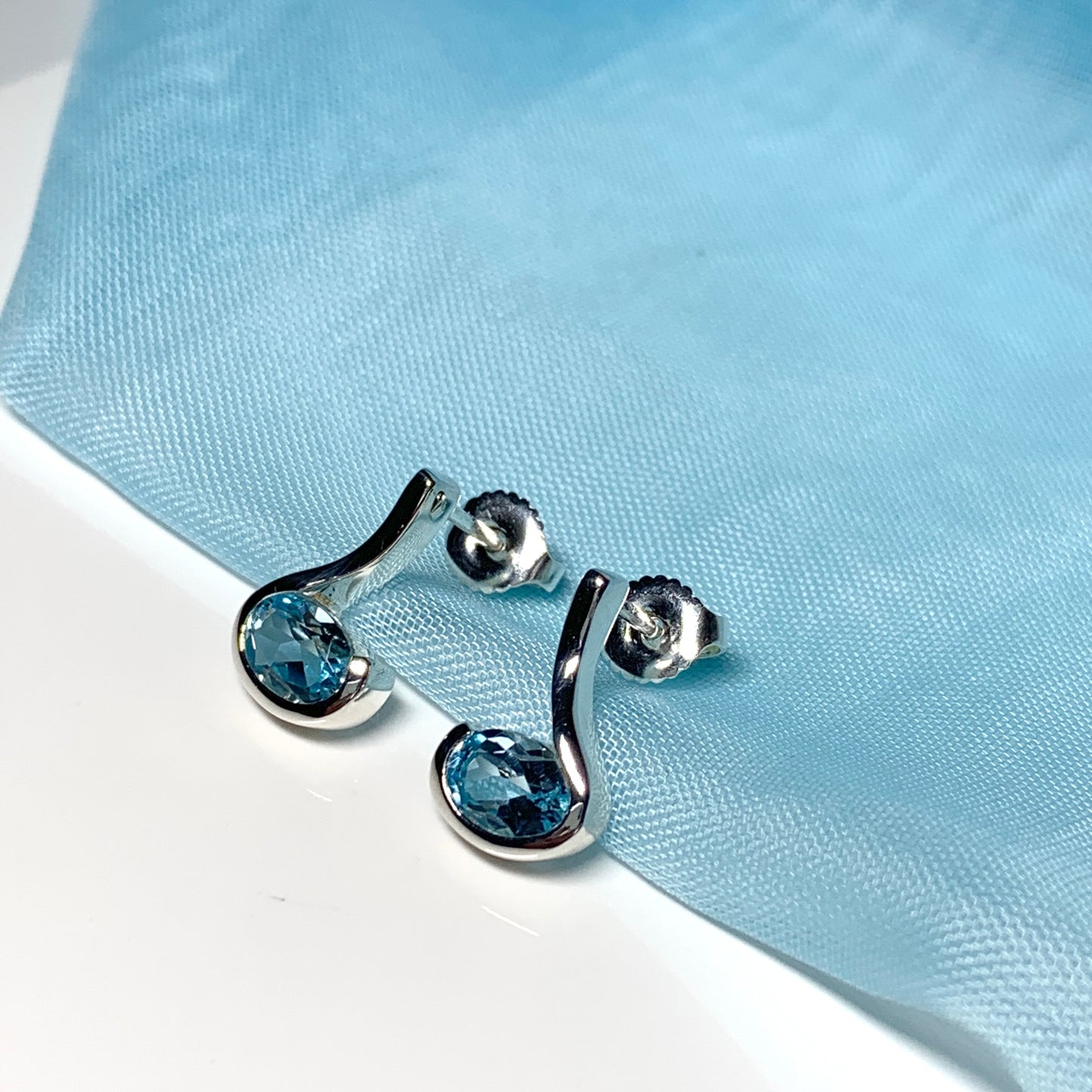Real blue topaz earrings fancy stud swirl