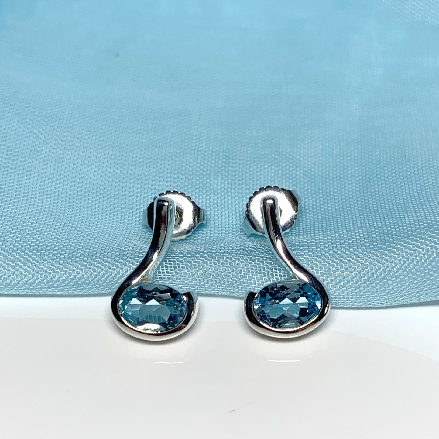 Real blue topaz earrings fancy stud swirl