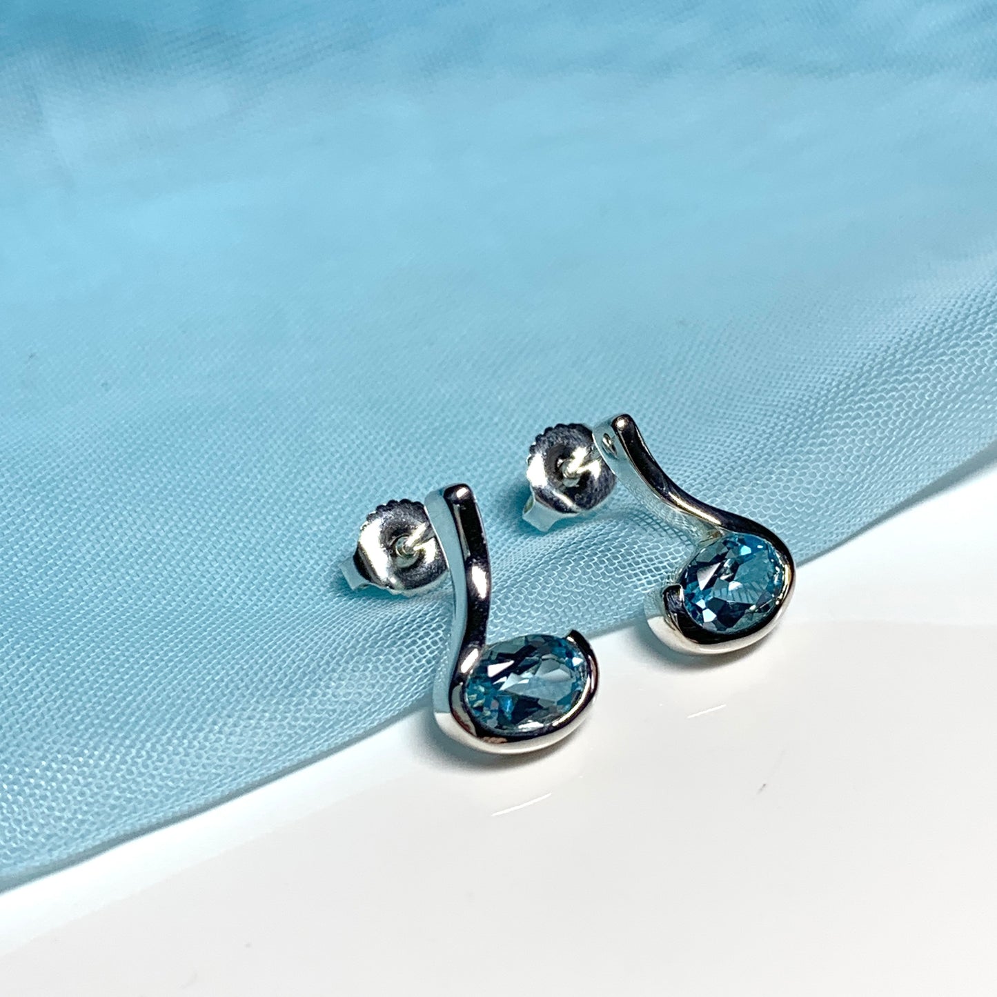 Real blue topaz earrings fancy stud swirl