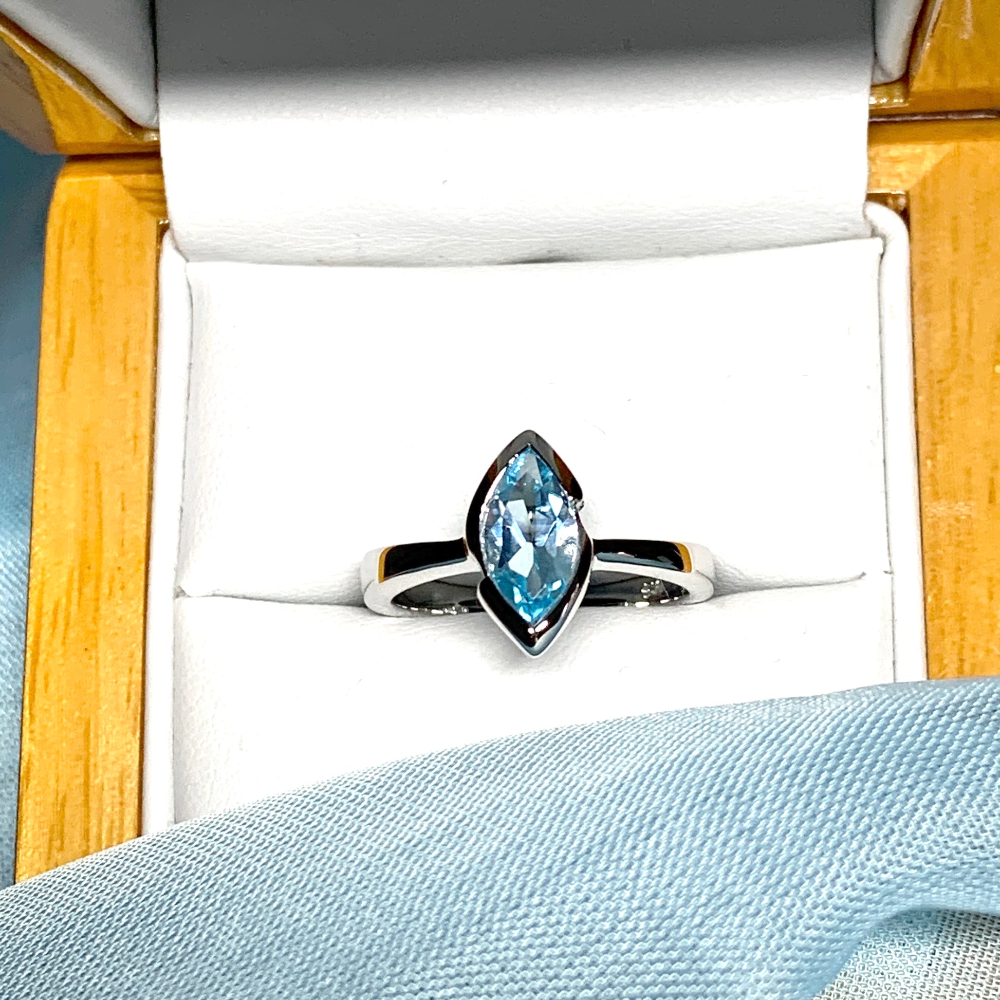 Real blue topaz ladies marquise shaped dress ring